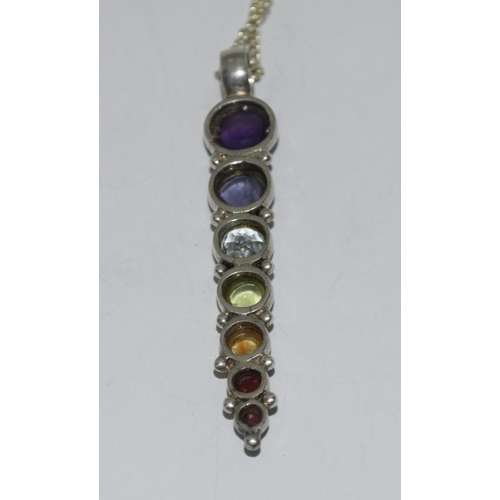 428 - Silver multi stone drop pendant.