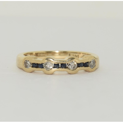 408 - 14ct Gold Diamond and Sapphire ring 3.6g . Size N.