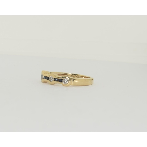 408 - 14ct Gold Diamond and Sapphire ring 3.6g . Size N.