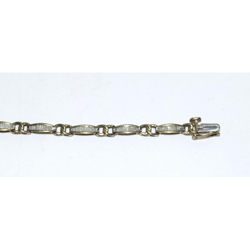 404 - 9ct gold ladies Diamond bracelet of approx 2ct set with bagget cut diamonds