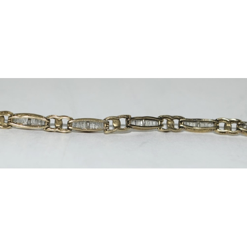 404 - 9ct gold ladies Diamond bracelet of approx 2ct set with bagget cut diamonds