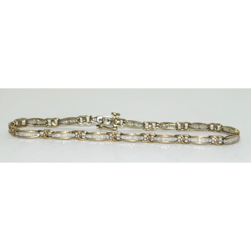 404 - 9ct gold ladies Diamond bracelet of approx 2ct set with bagget cut diamonds