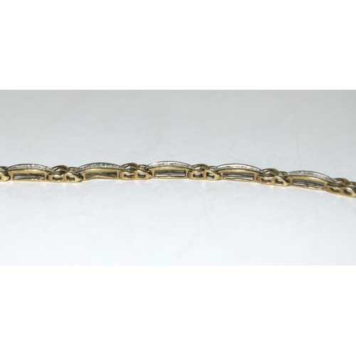 404 - 9ct gold ladies Diamond bracelet of approx 2ct set with bagget cut diamonds