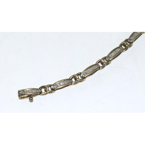 404 - 9ct gold ladies Diamond bracelet of approx 2ct set with bagget cut diamonds