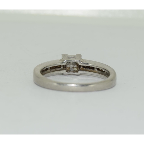 384 - Platinium ladies diamond ring set with diamond shoulders H/M in ring as 0.25ct size L