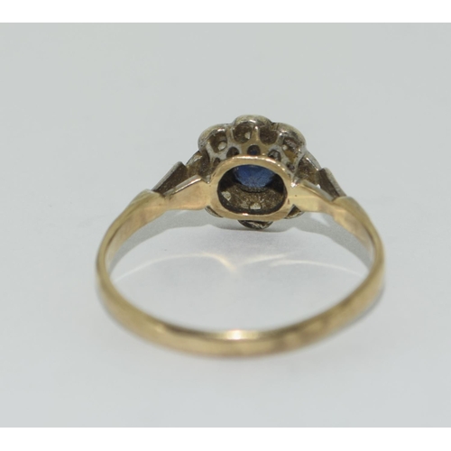 344 - 9ct gold ladies Diamond and Sapphire daisy ring size O