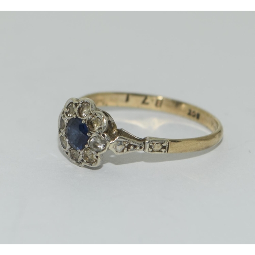 344 - 9ct gold ladies Diamond and Sapphire daisy ring size O