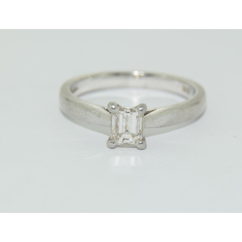 332 - Platinum Emerald Cut Diamond Solitaire Ring. Approx 0.25ct. Size L