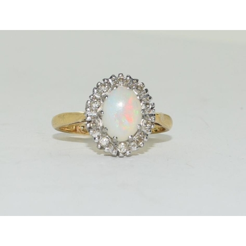 309 - 14ct gold ladies Diamond and Opal ring size J