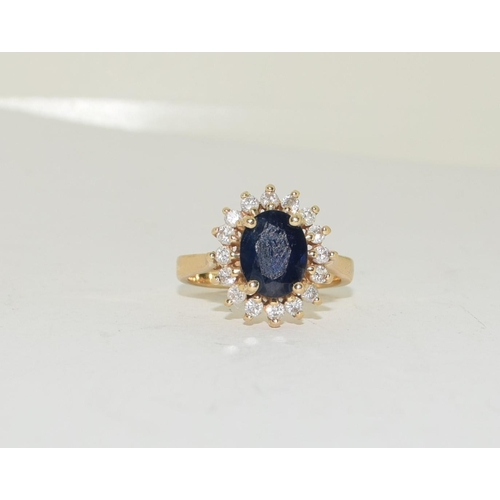 319 - 14ct gold ladies Princess Diana Sapphire and Diamond cluster ring size N