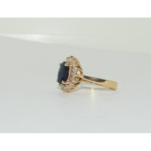 319 - 14ct gold ladies Princess Diana Sapphire and Diamond cluster ring size N