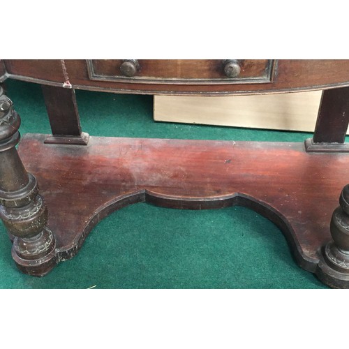 521 - A Victorian mahogany marble topped washstand with splash back on turned supports and drawer to centr... 