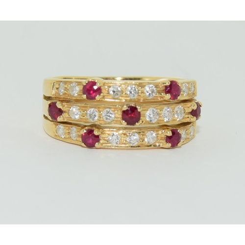 423 - 18ct Ruby and diamond ring, Size N.