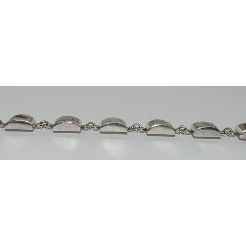 373 - A silver shell panel bracelet.