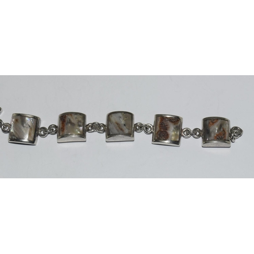 373 - A silver shell panel bracelet.