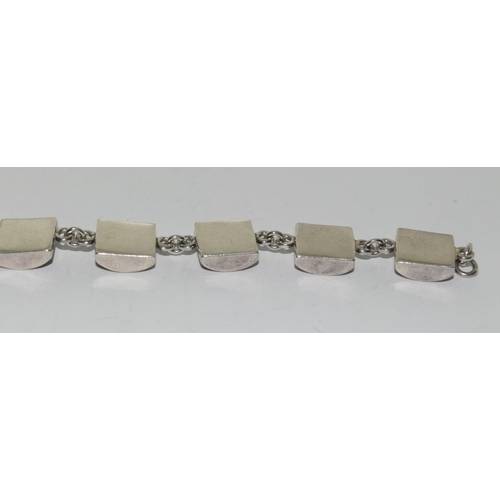 373 - A silver shell panel bracelet.