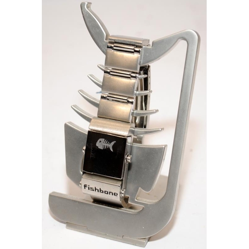 340 - Fishbone branded stainless steel 'reverso' watch/bracelet and stand