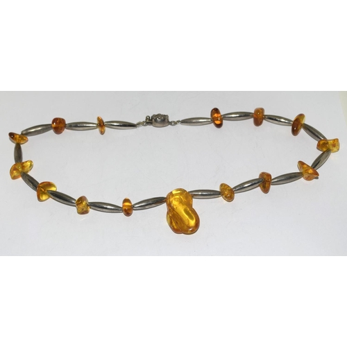 358 - Silver and amber necklace.