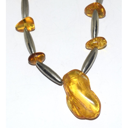 358 - Silver and amber necklace.