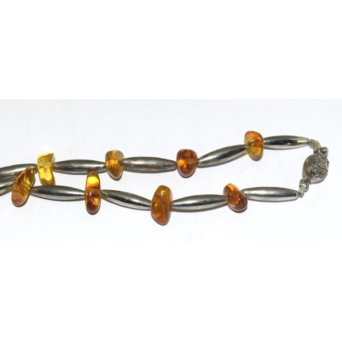 358 - Silver and amber necklace.