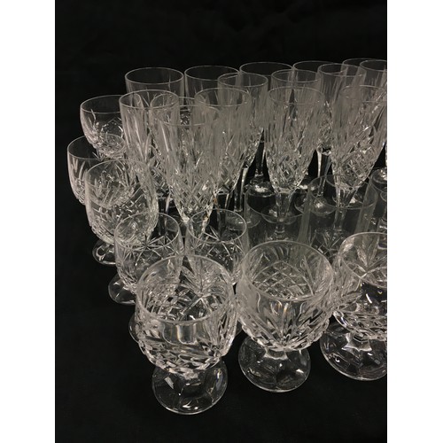 117 - Large collection of stemmed and some tumbler crystal drinking glasses.