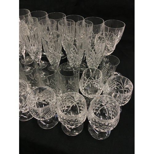 117 - Large collection of stemmed and some tumbler crystal drinking glasses.