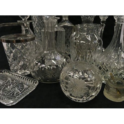 118 - Large collection of assorted crystal glassware to include decanters, vases and candlesticks.