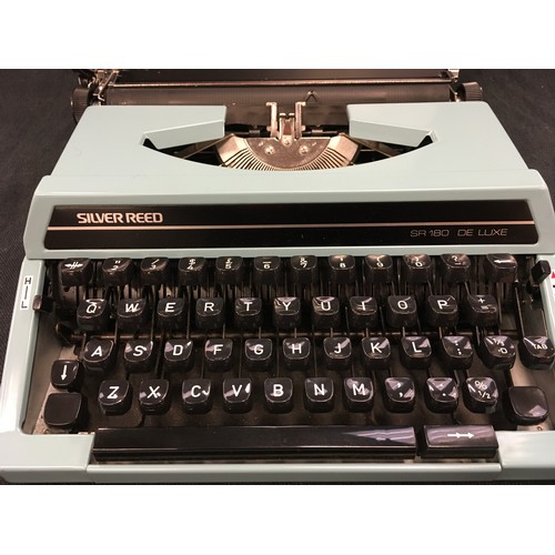 65 - Silver Reed SR 180 De Luxe typewriter.