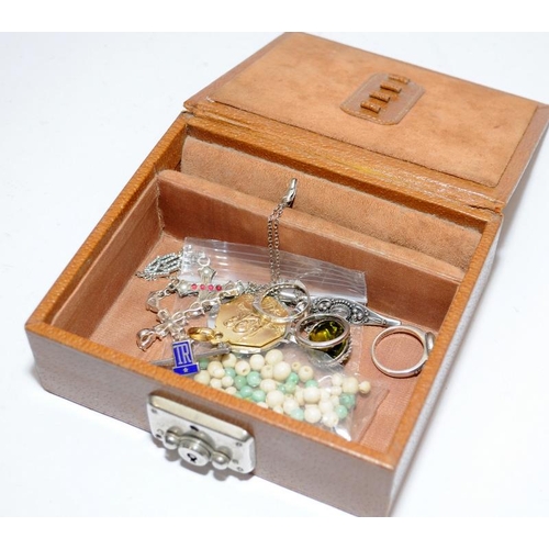 439 - A small quantity of silver and other jewellery in a leather bound wooden box