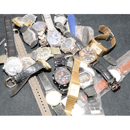 329 - Large quantity of gents fashion watches. All offered untested