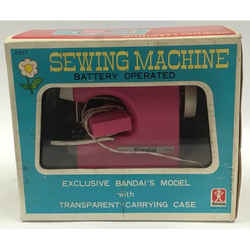 145 - Vintage Bandai early 1970's electric sewing machine in original box with instruction leaflet.