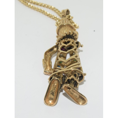 357 - 9ct gold Articulated clown figure on a gold chain set with semi precious stones clown 7cm chain 46cm... 