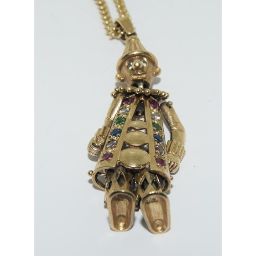 357 - 9ct gold Articulated clown figure on a gold chain set with semi precious stones clown 7cm chain 46cm... 