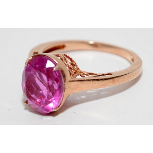 397 - A rose gold on 925 silver ring with pink stone to centre, Size P