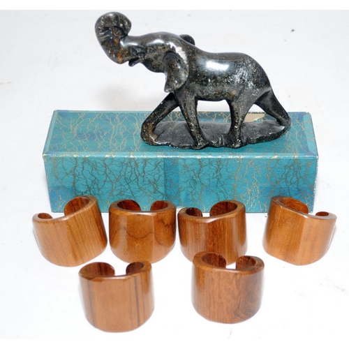 54 - Collection of small wooden carved horse figures together with a boxed set of wooden napkin rings and... 