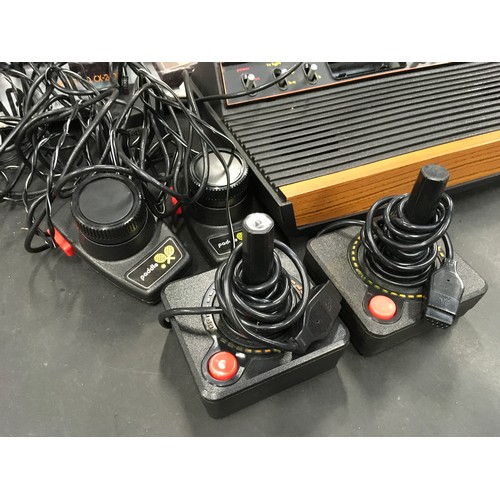 90 - Atari Video Computer System with original box, two joysticks and a pair of paddle controllers.