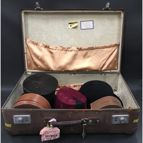 2 - Vintage globe trotter suitcase containing vintage gentleman’s hats and two smaller leather cases.