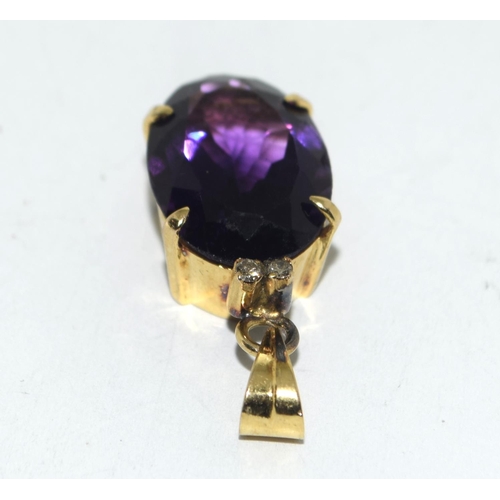 449 - Yellow metal Amethyst and Diamond pendant.