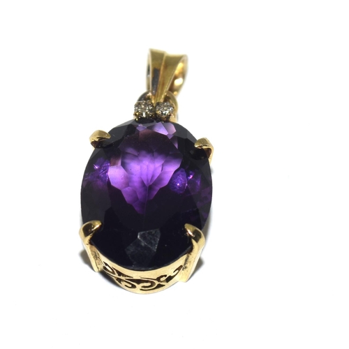 449 - Yellow metal Amethyst and Diamond pendant.