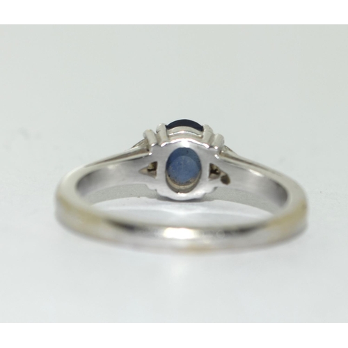 403 - White metal Diamond and Sapphire ring. Size N.