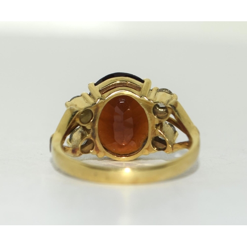 370 - 14ct gold Garnet and Diamond ring. Size Q.