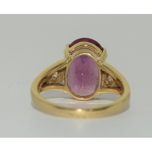 435 - 14ct Diamond and Pink Tourmaline ring. Size Q.