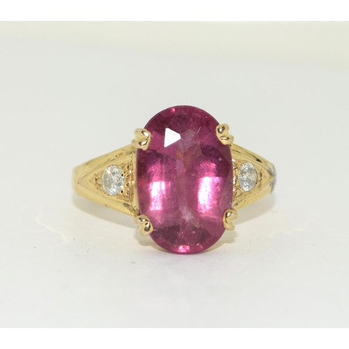 435 - 14ct Diamond and Pink Tourmaline ring. Size Q.