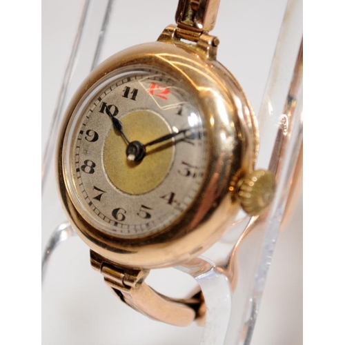 446 - 9ct gold ladies watch with expanded bracelet.