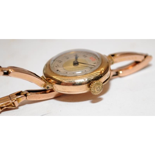 446 - 9ct gold ladies watch with expanded bracelet.