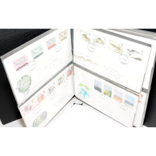 227 - A collection of first day covers contained within four albums together with a number of franked enve... 