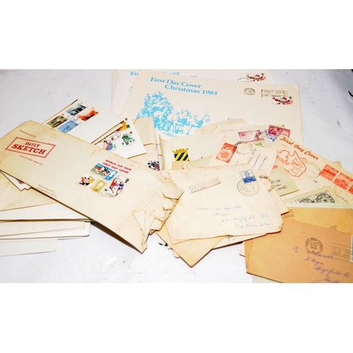 227 - A collection of first day covers contained within four albums together with a number of franked enve... 