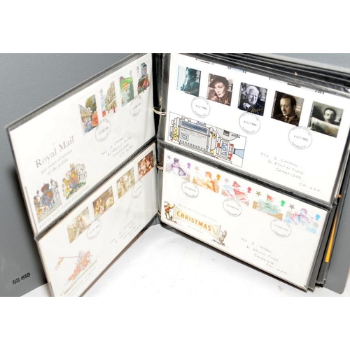 227 - A collection of first day covers contained within four albums together with a number of franked enve... 