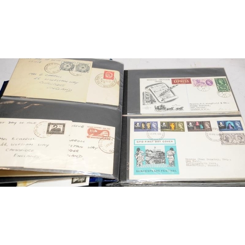 227 - A collection of first day covers contained within four albums together with a number of franked enve... 