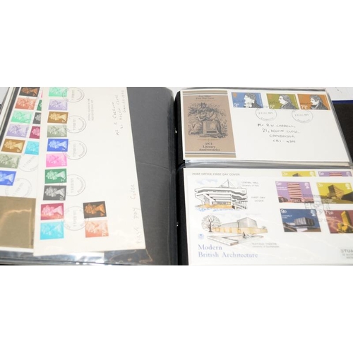 227 - A collection of first day covers contained within four albums together with a number of franked enve... 